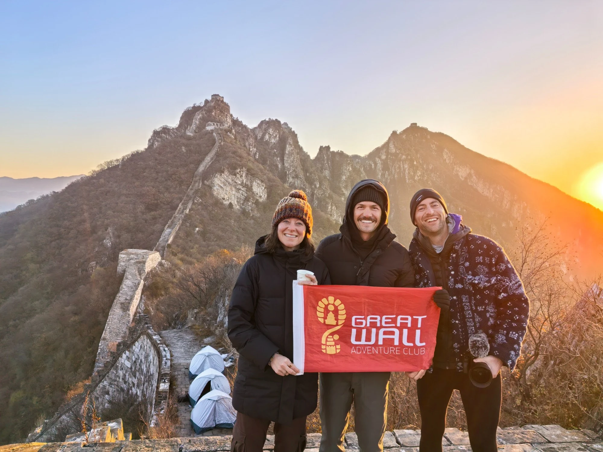 Travelers at sunrise on the Great Wall